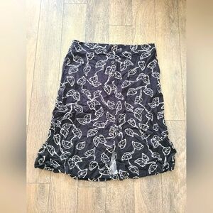 From Reitmans. NEVER BEEN WORN. Button Down Midi Skirt. SIZE 12